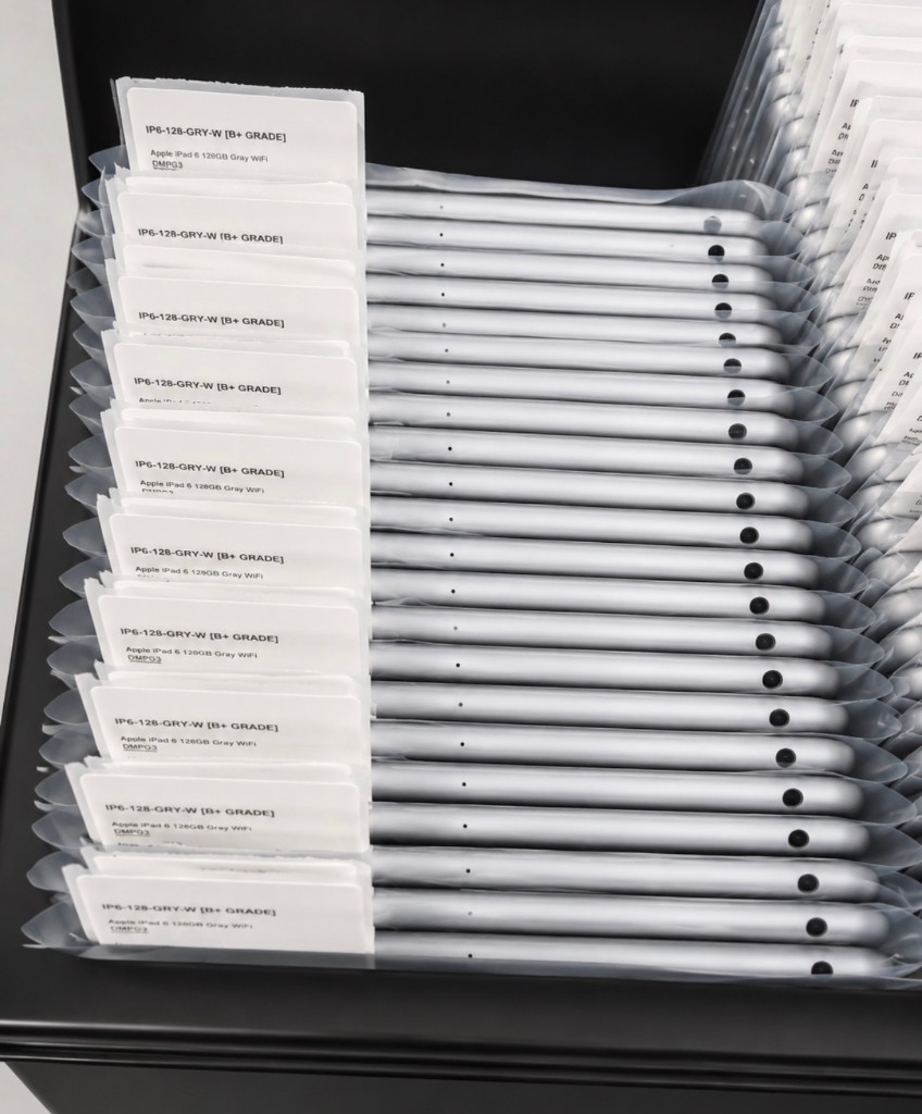 Graded iPads organized in storage bins with condition labels